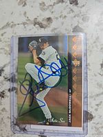 Front of Jack McDowell signed Upper Deck SP trading card in sleeve