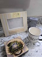 All four items grouped: photo frame, desk plaque, mug, jewelry holder