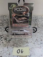 Front of sealed blister package showing Foose '70 Monte Carlo die-cast car