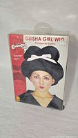 Front of sealed package showing Geisha Girl Wig branding and model photo