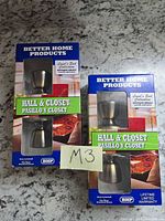 Front view of two sealed Better Home Products Hall & Closet doorknob set boxes