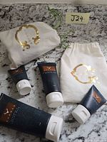 Five C Wonder facial care tubes and two branded pouches on countertop