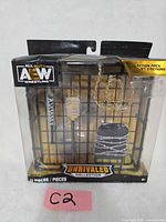 Front of sealed AEW Unrivaled Collection Action Pack showing accessories through window