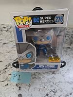 Front view of boxed Funko Pop Owlman showing number 276 and Hot Topic sticker