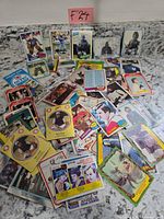 Spread of numerous hockey trading cards showing fronts and backs