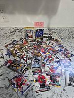 Pile of assorted NHL hockey cards on counter