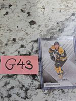 Front view of Ryan Spooner serial-numbered card with lot tag