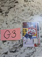 Front of card with player image and jersey swatch