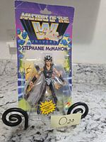 Front of unopened Masters of the WWE Universe Stephanie McMahon figure showing artwork and character in blister