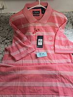 Front view of shirt showing stripes, collar, tags attached