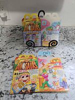 Both flat Happy Meal boxes displayed front side