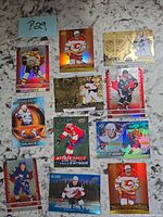 Overview of all 11 insert cards laid out on surface