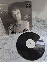 Front sleeve showing Nils Lofgren portrait and opened record