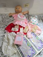Doll with clothing and accessories laid out
