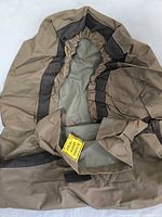 Grill cover laid out showing elastic hem and interior vent mesh