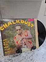 Front cover showing album art and partial vinyl