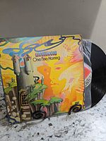 Front of "One Fine Morning" record jacket on stand with vinyl partially visible