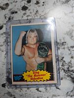 Front view of Greg Valentine trading card in sleeve