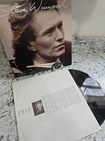 Front jacket displayed with record partly out of sleeve