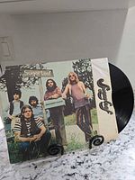 Front sleeve showing band and album title with vinyl partially visible