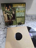 Front of album jacket with record and inner sleeve