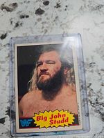 Front of Big John Studd WWF trading card in sleeve