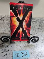 Front view of The X-Files Conduit/Ice VHS sleeve on stand