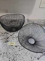 Top view of both black wire baskets on countertop