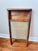 Full view of washboard front showing wood frame and metal panel
