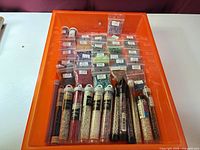 Full view of orange tray containing bead tubes and bags