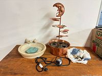 Bird bath, copper fountain assembly, pump cord, stones