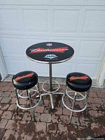 full view of pub table and two stools