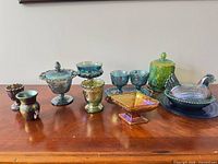 Full lot of twelve carnival glass pieces displayed on table