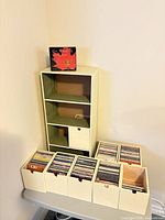 Overall view of shelving unit with CD boxes filled with discs