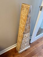 Full view of tall tapered chest front