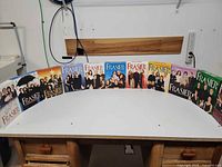 Front view of all eleven Frasier season DVD box sets displayed in a row
