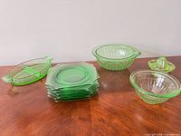 Overall lot view showing plates stack, bowls, dish, juicer