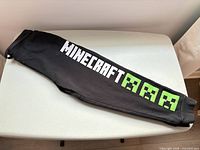 Full view of sweatpants showing logo and Creeper graphics