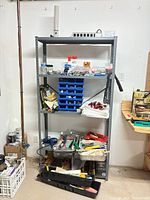 Full view of metal shelving unit with contents