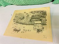 Full view of signed Paulin concert print on table