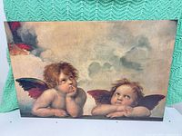 Front view of canvas showing cherubs artwork