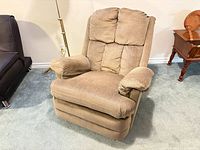 Front view of beige reclining armchair