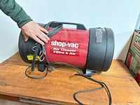 Overall view of cylindrical Shop-Vac air cleaner on table
