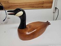 Profile view of wooden Canada goose decoy