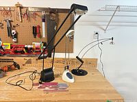 Overview of all three desk lamps on workbench