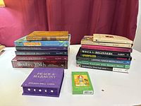 Full view of both stacks of books and two card decks