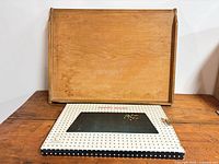 Wooden bread board and boxed marble board front view