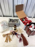 Group shot showing ball ornaments, bead garlands, boxed ornaments, decorative pieces