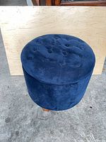 Closed ottoman showing overall shape, color and upholstery