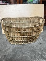 Front angled view of oval wicker basket